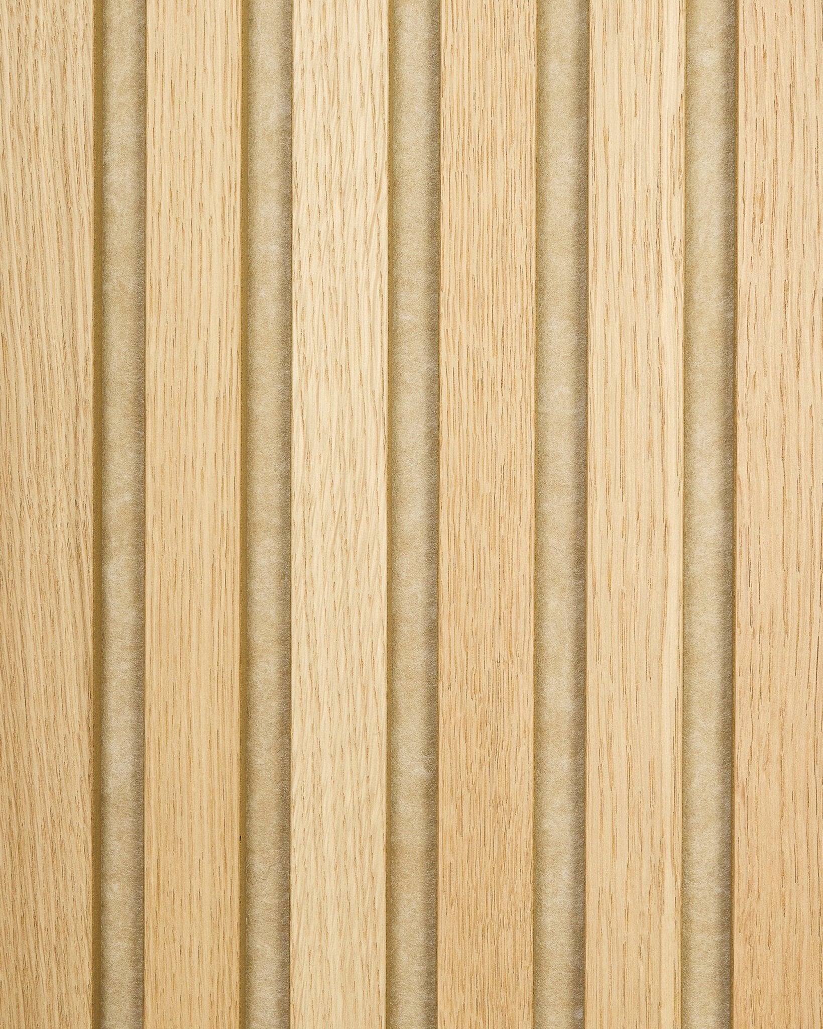 Akupanel sample in Classic Oak with beige felt backing, featuring light oak acoustic wood slats and vertical grooves for a striped, textured surface.